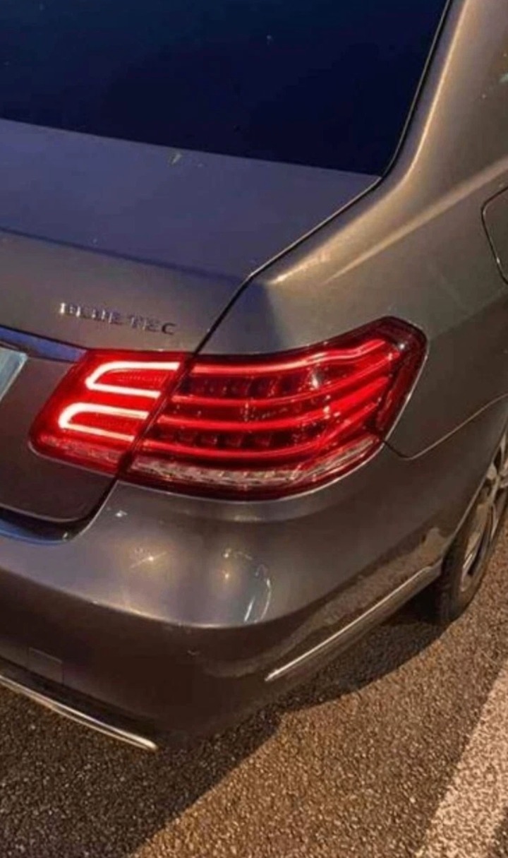 Silver Mercedes E-Class BlueTEC with repaired rear light fully lit